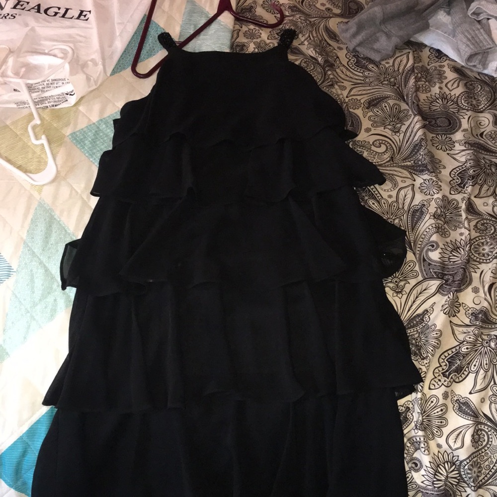 Ruffled black formal dress with sequenced straps